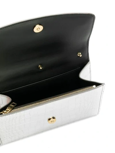 Shop Dolce & Gabbana Crocodile Embossed Metallic Clutch In Silver