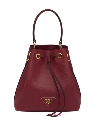 Shop Prada Saffiano Bucket Bag In Red