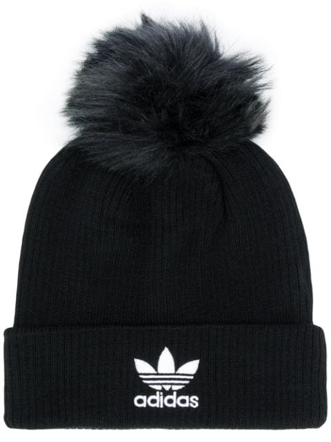 black wooly hat with fur pom pom