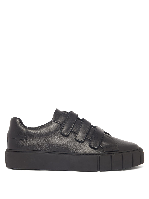 black trainers with velcro straps