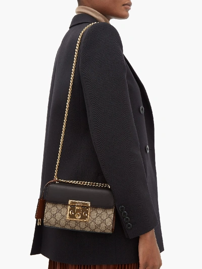 Push-lock GG Supreme small cross-body bag, Gucci