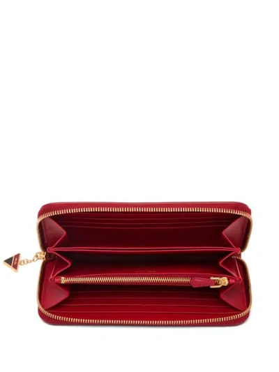 Shop Prada Saffiano Logo Continental Wallet In Red