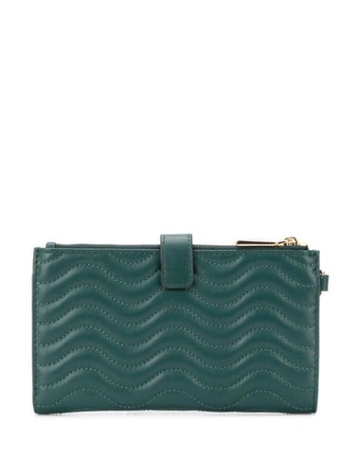 Shop Michael Michael Kors Large Quilted Wallet In Green