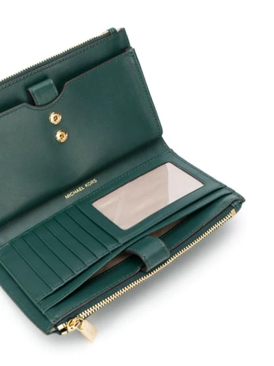 Shop Michael Michael Kors Large Quilted Wallet In Green