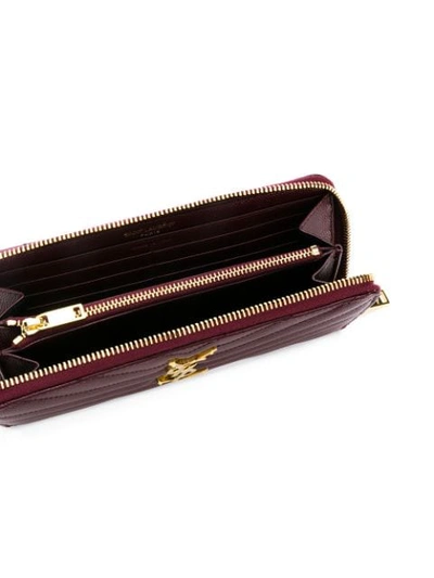 Saint Laurent Monogram Zip Around Wallet In Red
