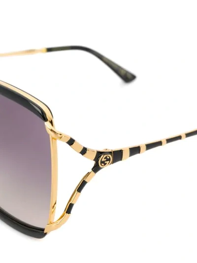 Shop Gucci Stripe Detail Sunglasses In Black