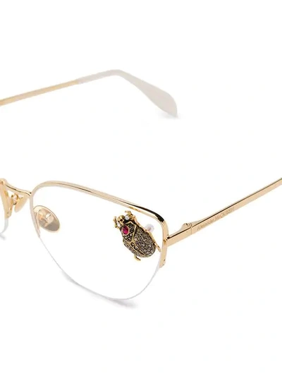 Shop Alexander Mcqueen Beetle Appliqué Sunglasses In Gold