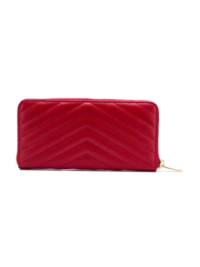Shop Saint Laurent Monogram Zip-around Wallet In Red