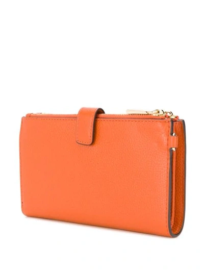 Shop Michael Michael Kors Jet Set Zipped Wallet In Orange