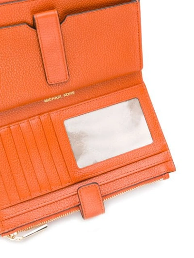 Shop Michael Michael Kors Jet Set Zipped Wallet In Orange