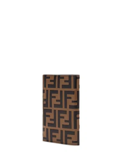 Shop Fendi Debossed Ff Passport Wallet In Brown