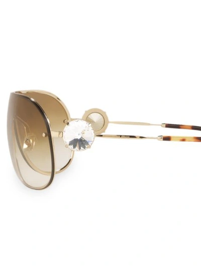 Shop Miu Miu Enchant Sunglasses In Gold