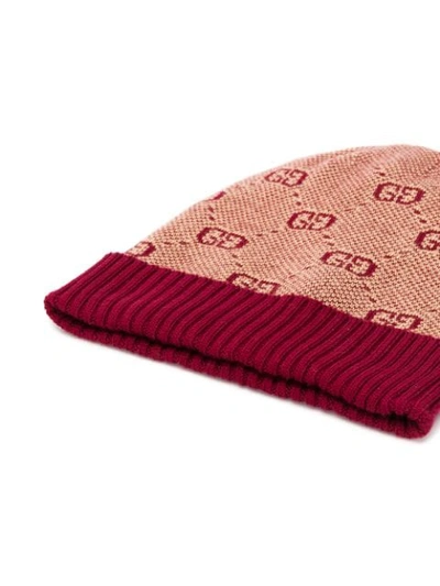 Shop Gucci Knitted Gg Beanie In Red