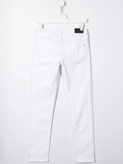 Shop Msgm Logo Print Distressed Jeans In White