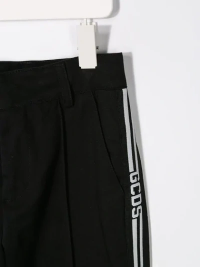 Shop Gcds Stripe Trim Trousers In Black