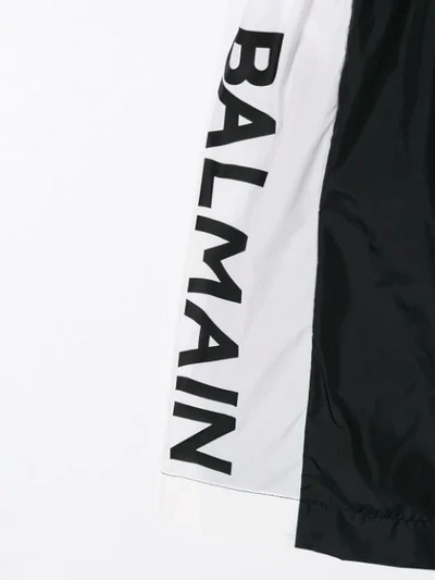 Shop Balmain Printed Logo Swim Shorts In Black