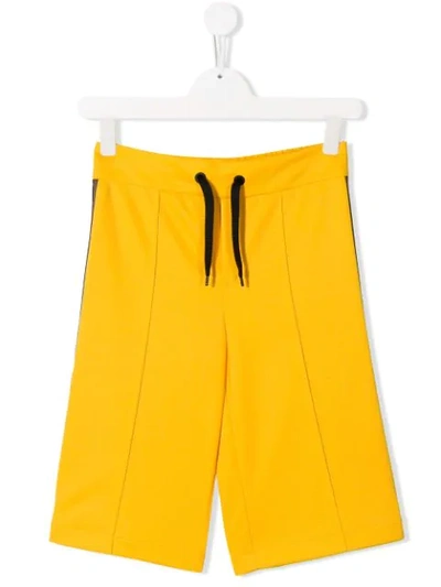 Shop Fendi Teen Logo Appliqué Shorts In Yellow