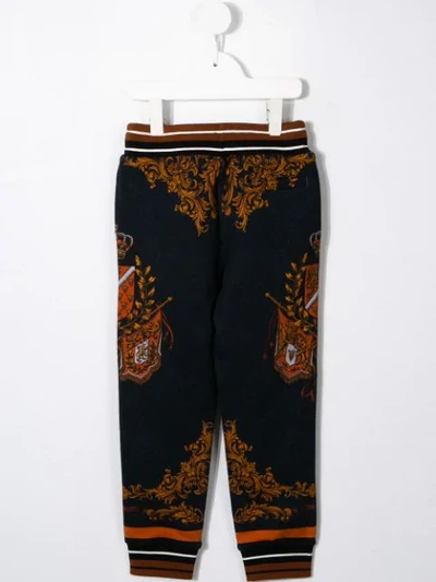 Shop Dolce & Gabbana Cuffed Crest-print Track Pants In Blue