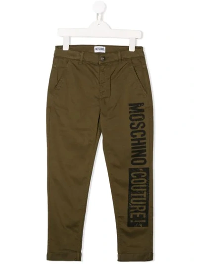 Shop Moschino Logo Print Trousers In Green