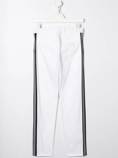 Shop Gcds Side-stripe Trousers In White