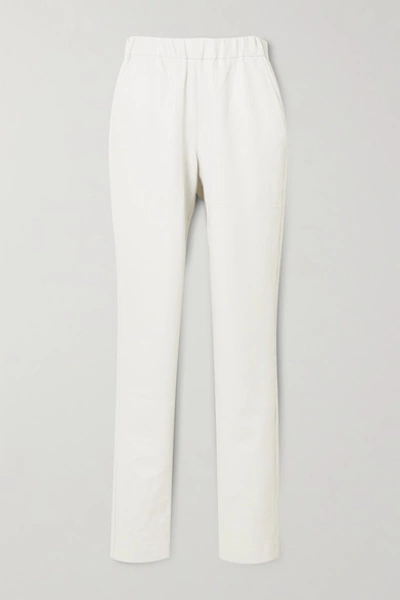 Shop Tibi Faux Leather Tapered Pants In White