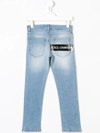Shop Dolce & Gabbana Washed Distressed Jeans In Blue