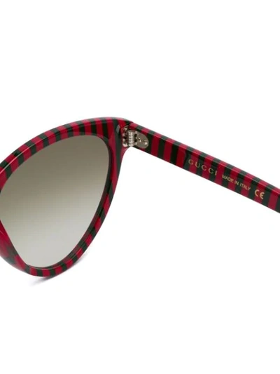 Shop Gucci Striped Cat Eye Sunglasses In Red