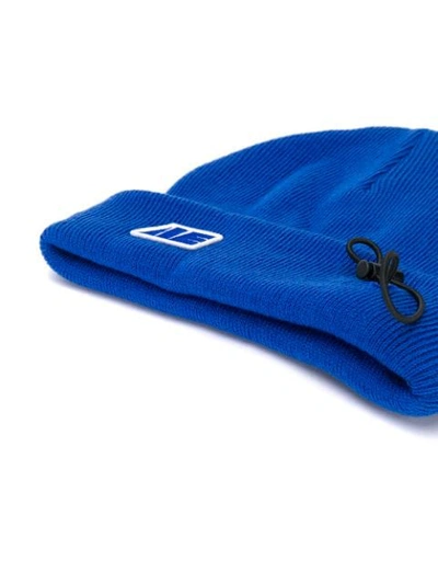 Shop Ader Error Drawstring Beanie In Blue