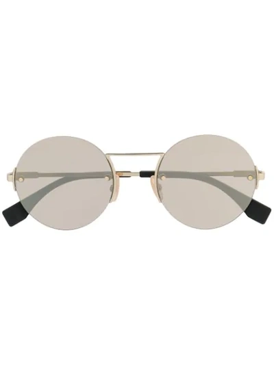 Shop Fendi Round Frame Sunglasses In Gold