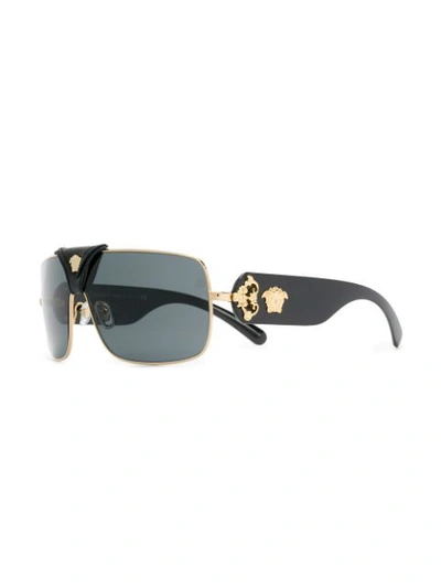 Shop Versace Leather Logo Detail Sunglasses In Black