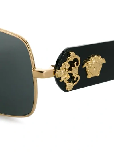 Shop Versace Leather Logo Detail Sunglasses In Black
