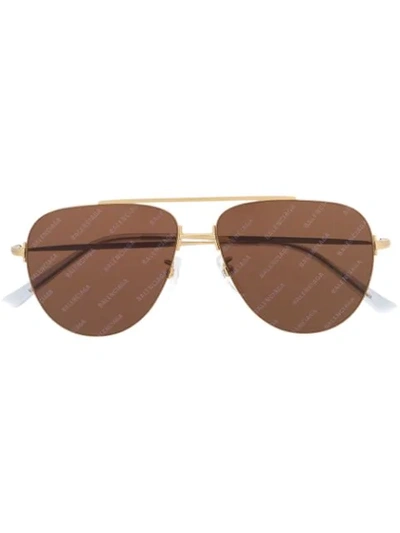 Shop Balenciaga Logo Aviator Shaped Sunglasses In Gold