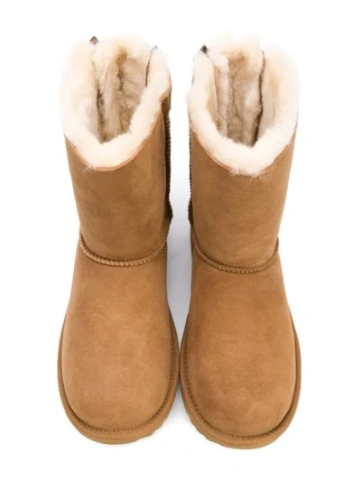 Shop Ugg Teen Bow Shearling Boots In Brown