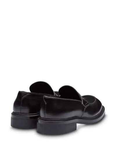 Shop Prada Brushed Penny Loafers In Black