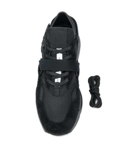 Shop Ih Nom Uh Nit Buckle Strap Low Top Sneakers In Black