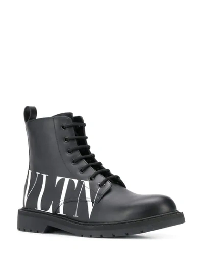 Shop Valentino Vltn Boots In Black
