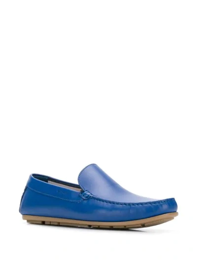 Shop Tommy Hilfiger Logo Embossed Loafers In Blue