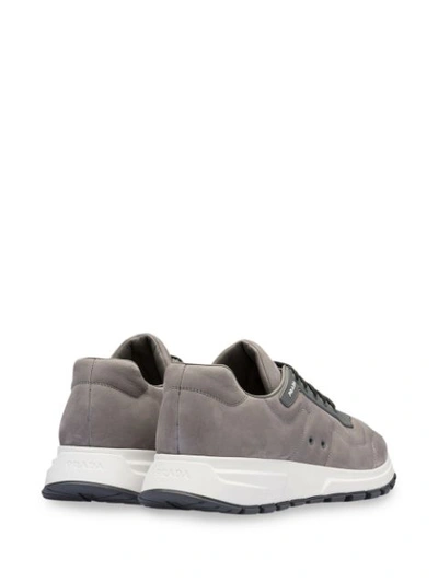 Shop Prada Logo-appliquéd Sneakers In Grey