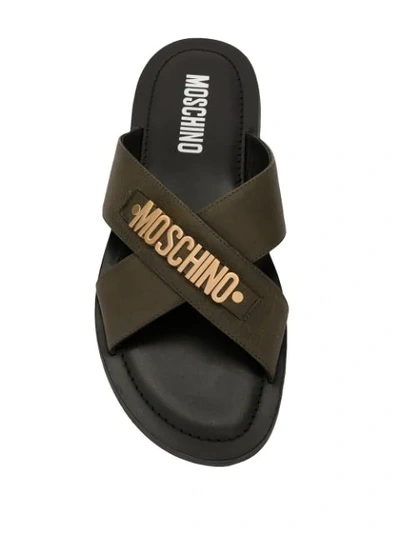 Shop Moschino Logo Plaque Crisscross Sandals In Green