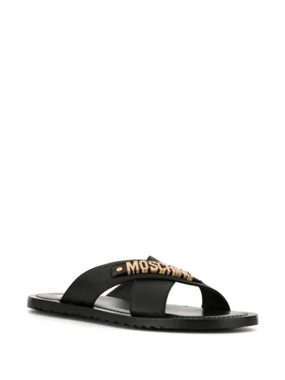 Shop Moschino Logo Plaque Crisscross Sandals In Mos.000
