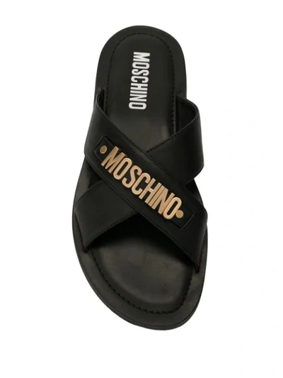 Shop Moschino Logo Plaque Crisscross Sandals In Mos.000