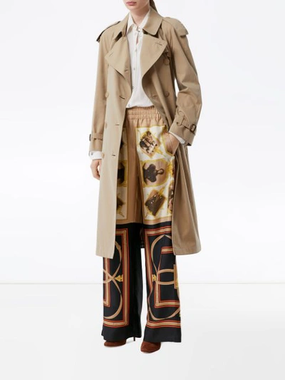 Shop Burberry Montage Print Flared Trousers In Brown