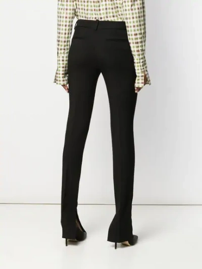 Shop Victoria Beckham Split Ankle Trousers In Black