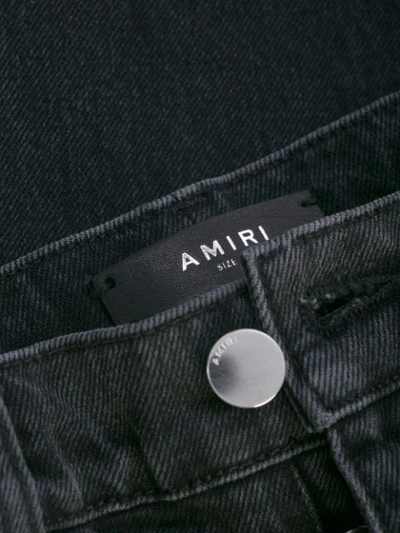 Shop Amiri Broken Side Stud Straight Jeans In Black