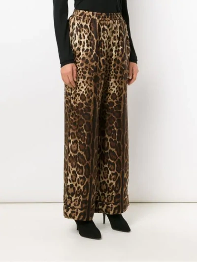 Shop Dolce & Gabbana Elastic Waist Animal Print Trousers In Brown