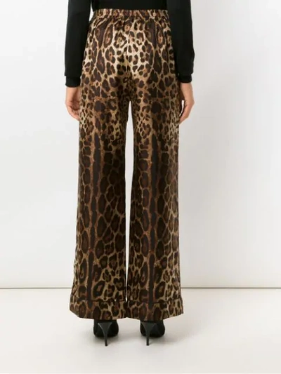 Shop Dolce & Gabbana Elastic Waist Animal Print Trousers In Brown