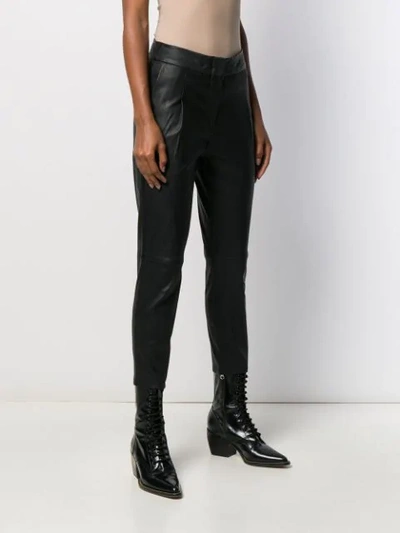 Shop Arma Tapered Leather Trousers In Black