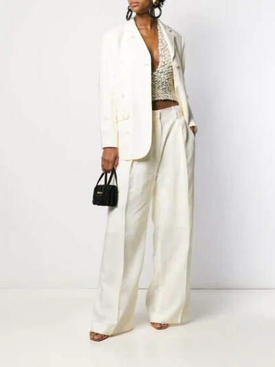 Shop Jacquemus Pleated Details Wide-leg Pants In White