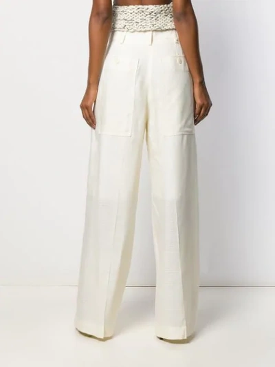 Shop Jacquemus Pleated Details Wide-leg Pants In White