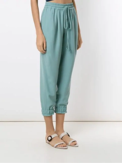 Shop Martha Medeiros Crepe Tapered Trousers In Green